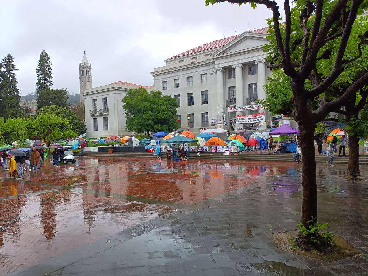 Rain or shine, students are holding down the Free Palestine encampment at UC Berkeley. The Teach-In had to be done indoors, though.