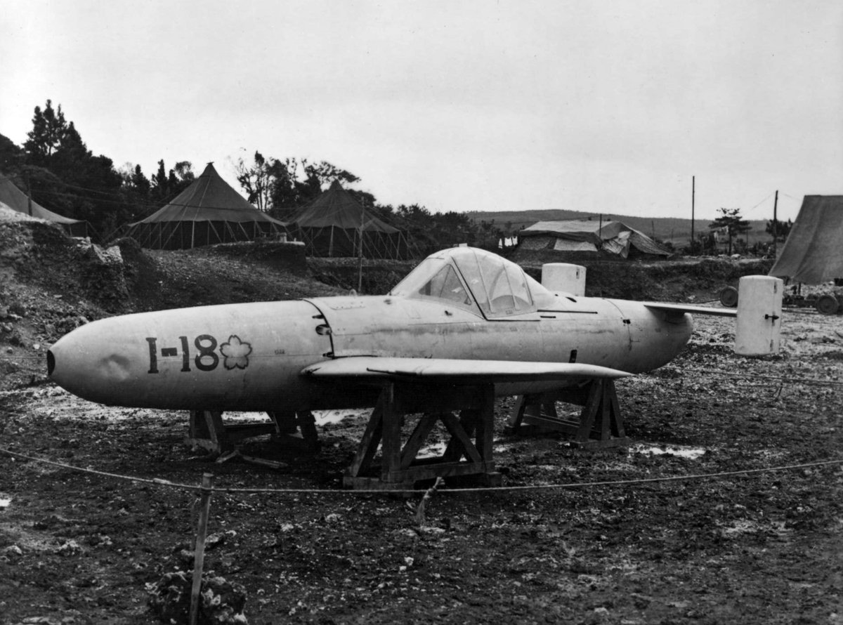 A captured Japanese MXY7 Ohka Model 11 rocket-powered, human-guided kamikaze attack aircraft at Yontan Airfield on Okinawa, in April, 1945. #History #WWII