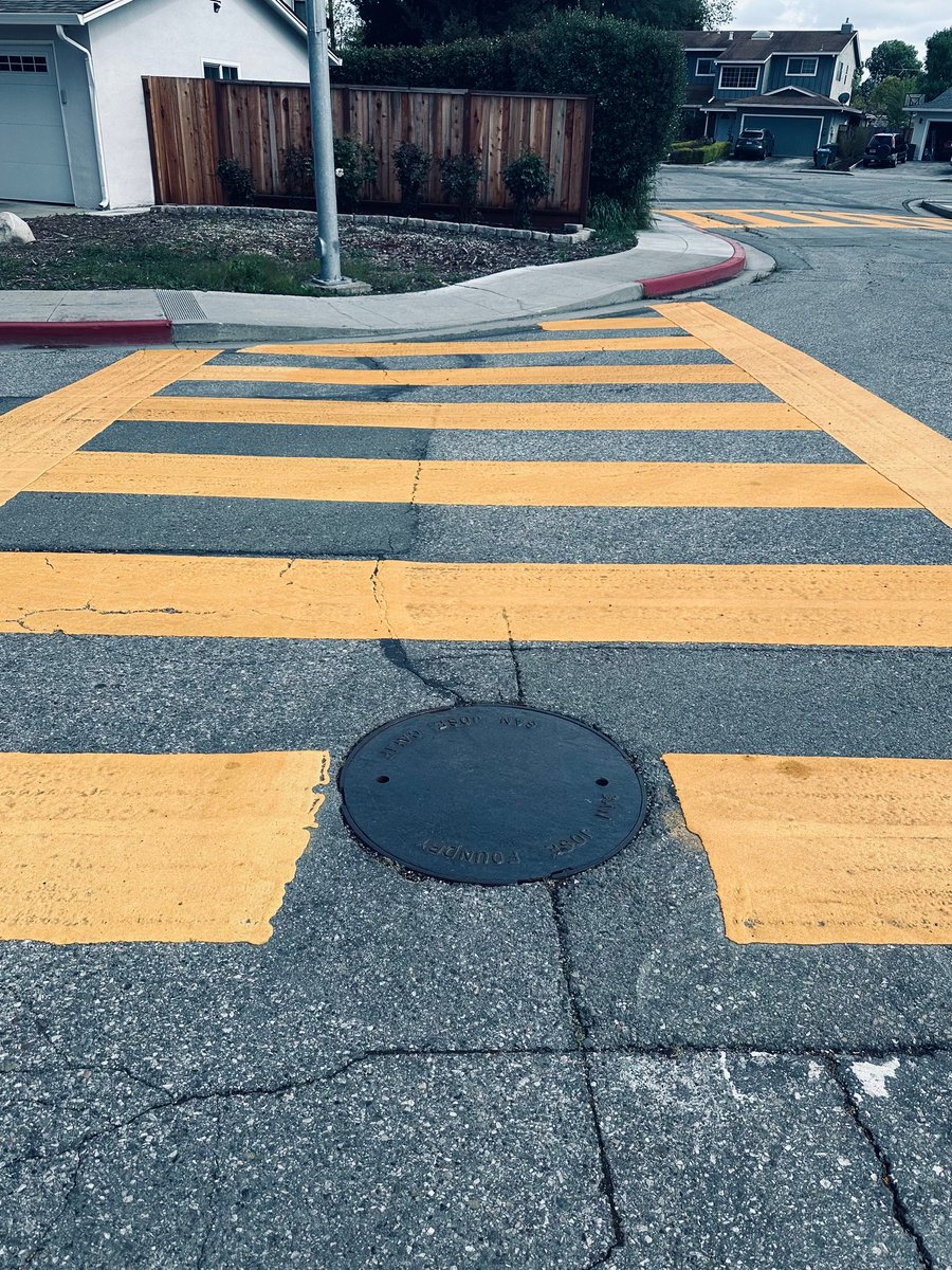 OK people, here's a real-life challenge

This travesty is on a crosswalk near my home. My challenge to artists is to come up with a creative way to transform this into a work of art. The rules:

1) Maximum two colors (two cans of spray paint)
2) Maximum 5 minutes to transform (I…