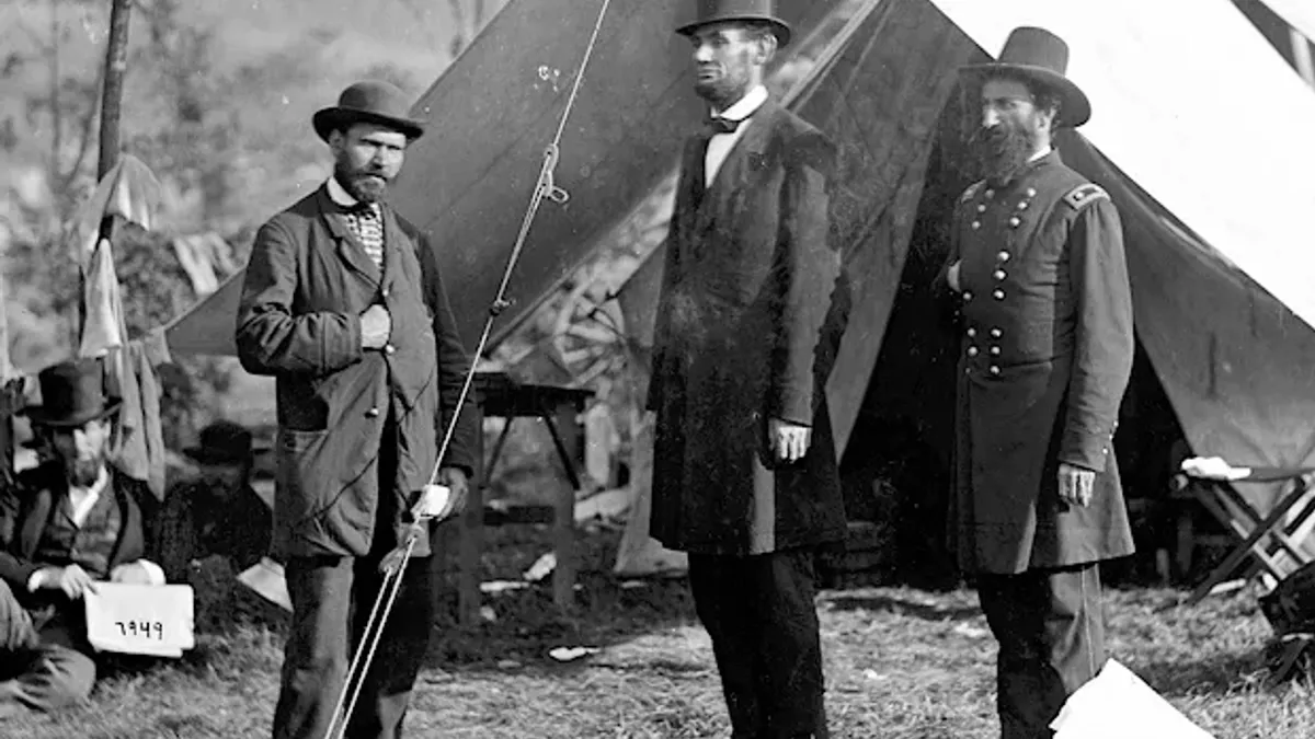 This is Abraham Lincoln with Allan Pinkerton and Maj. Gen. John A. McClernand in Antietam, Maryland, after the Battle of Antietam on Oct. 3, 1862. Both Pinkerton and McClernand are displaying the hidden hand pose.