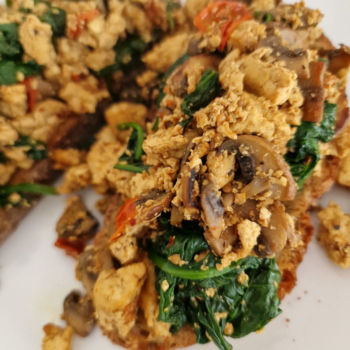 Tofu scramble with mushrooms, tomatoes, and spinach on toasted sourdough  💚 #vegan #veganfood