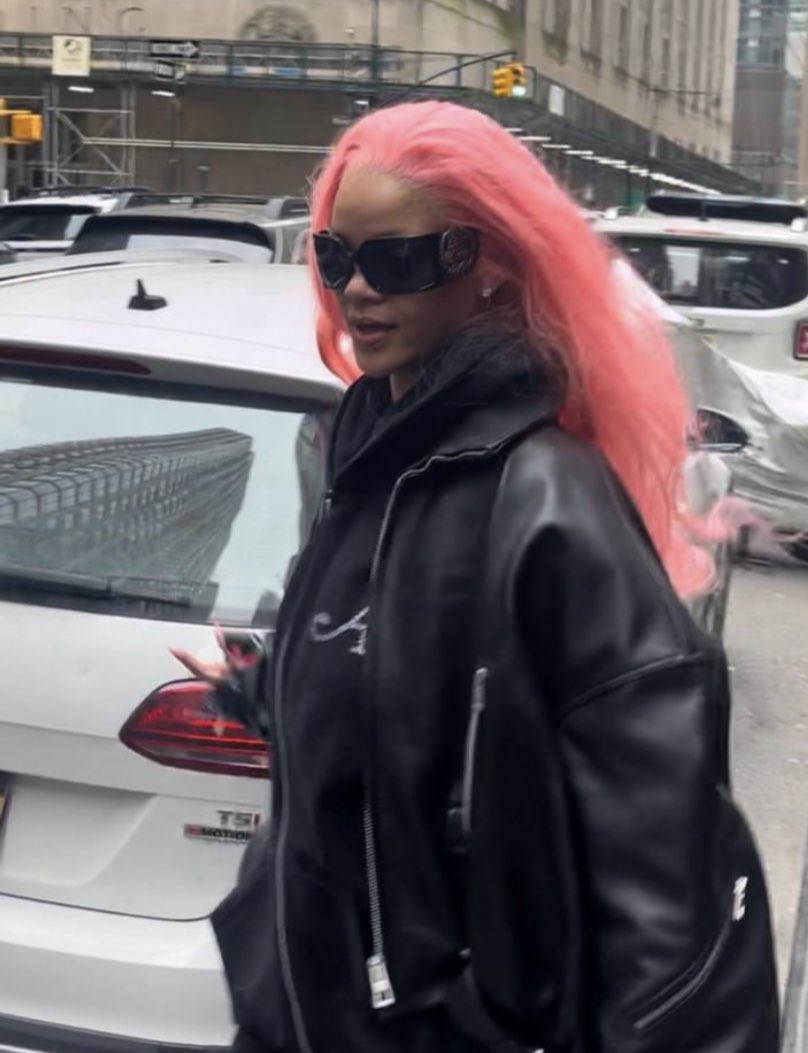 Rihanna spotted with pink hair in New York.