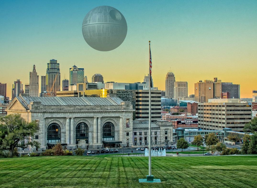 An early evening view of the Moon sitting low in the sky over Downtown KC. #ThatsNoMoon #Maythe4thBeWithYou #StarWarsDay Original photo by Kent Auf Der Heide.