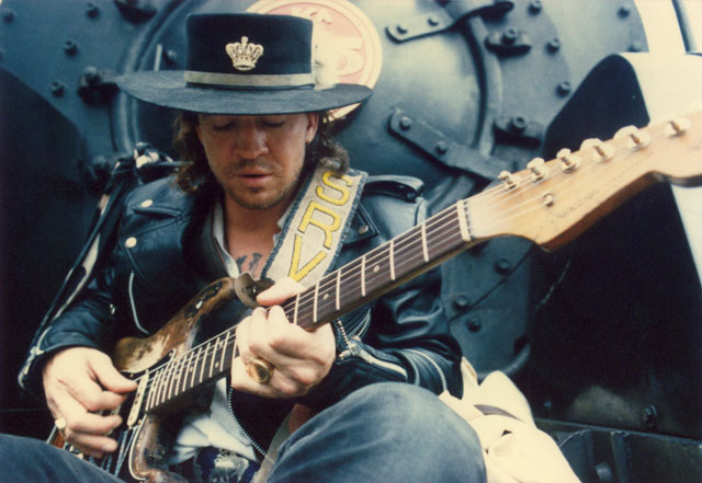 Stevie Ray Vaughan sitting on the front of an old locomotive during a visit to New Zealand in February 1988. Photo by Janna LeBlanc