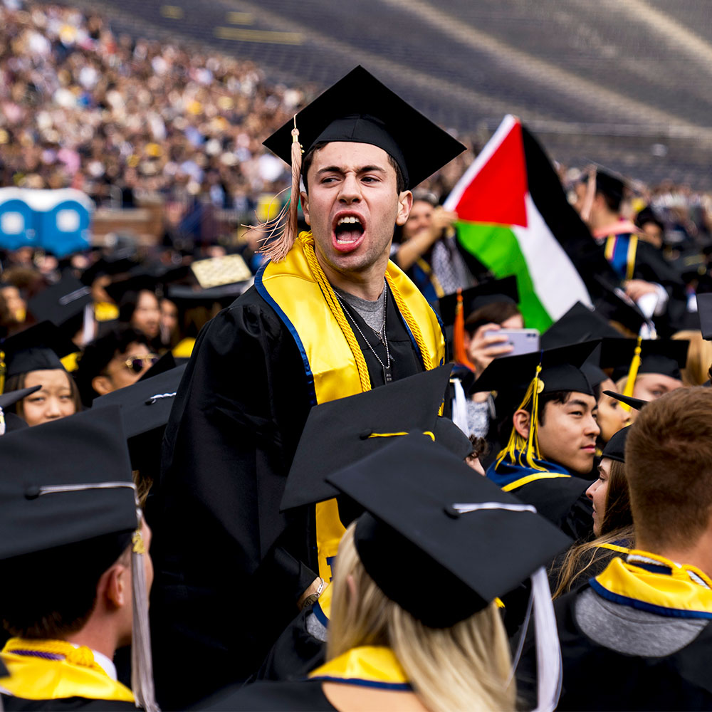 CAP AND FROWNS: Anti-Israel agitators disrupt University of Michigan's main commencement ceremony with chants and signs. Latest developments on campus chaos sweeping the country: trib.al/N6YgAUD