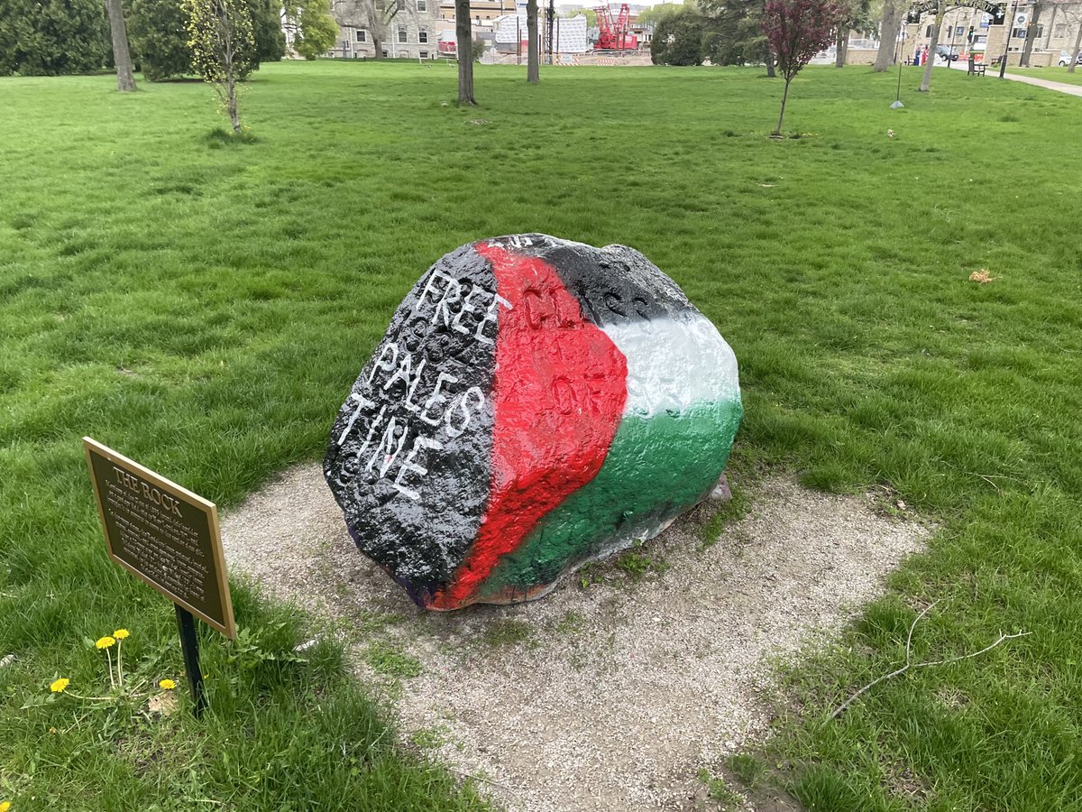 The movement for peace and justice for the people of Gaza has spread to college campuses nationwide. Here is the iconic “Class of 1895” rock on Lawrence University’s great lawn in Appleton, WI—painted with the colors of the Palestinian flag and with the message “Free Palestine.”