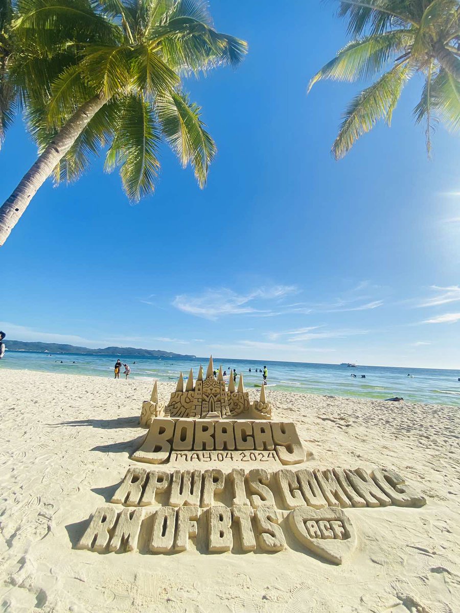 army_cavite's tweet photo. Yesterday (May 4), Head Admin Bie suggested some ideas to Mommy Jess (also an ACF Admin) on how we can promote #RightPlaceWrongPersonByRM effectively.

The ideas were: Sand Castle promo and Admin Bie promoting while parasailing, both of which we successfully executed.

Sandcastle art can be expensive because we pay for the detailed effort and talent, and if we wanted something that would last for days, it would cost more. So, we opted for something that could be built and then erased after a few hours. Our RPWP sandcastle promotion lasted around 4 hours, but thankfully, a lot of foreigners and locals saw it. This promotion wouldn't have been successful without the help of our fellow ARMY who reside here in Boracay. We thank our BPST member, Jobylee, for finding us a talented sandcastle artist. It was nice to finally meet you!