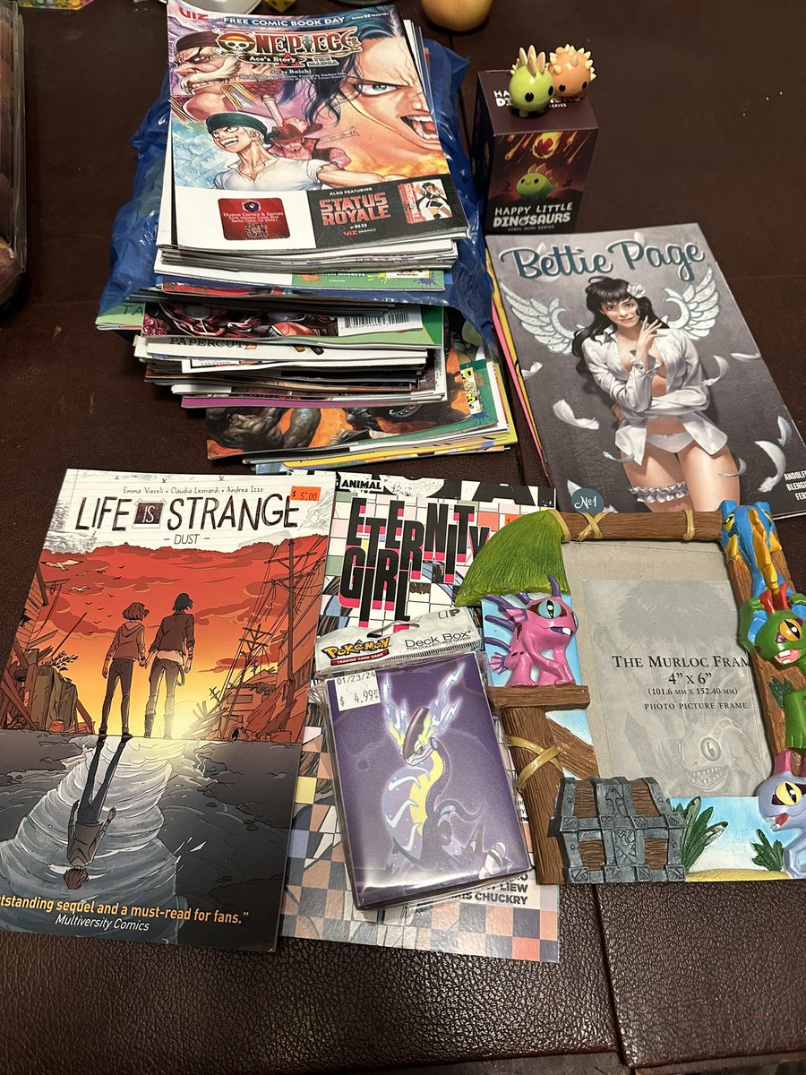 flotsam78's tweet photo. This years Free Comic Book Day haul!  We didn’t go too crazy, only made it to 4 places. @IllusiveComics is always the first stop though 💜 glad to see so many people braved the rain to be there at opening. #FreeComicBookDay https://t.co/TxxTkmCa9S