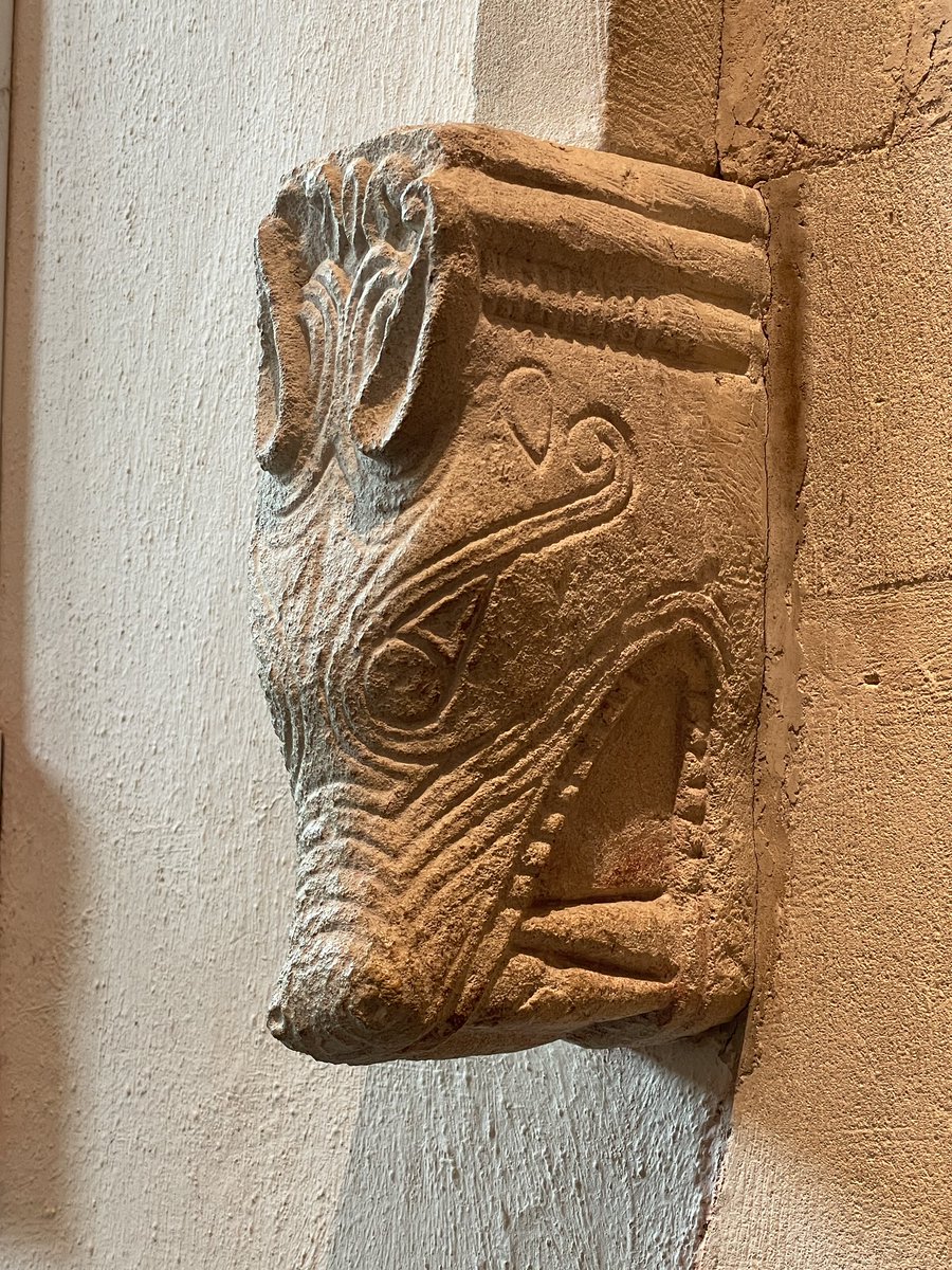 One of a pair of Saxon carved animal heads either side of door inside St Mary’s Priory Church, Deerhurst, Gloucestershire. Wolf or dragon? #SundayStonework #Saxon