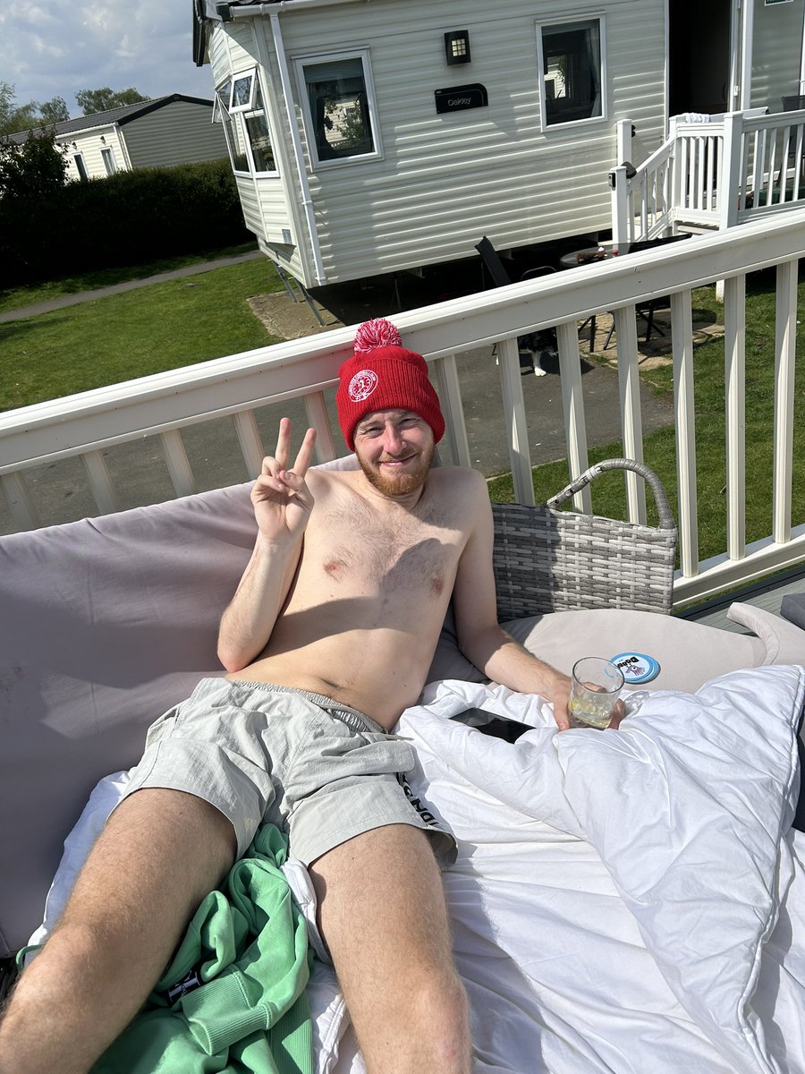 This ladies and gents is my partner 🙃 19 degrees sun shining and he’s sat in his Parkgate bobble hat so his head doesn’t burn🤣 @dannybswfc @parkgatefc send help🫣