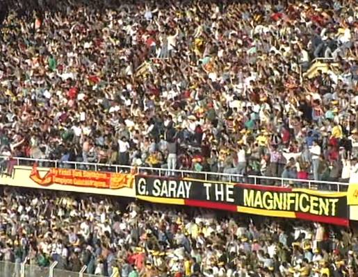 It was quite common during 1990s to see banners in English at Sami Yen stadium, Probably because Galatasaray's role as the leading Turkish team in European competitions. Spesifically this "G.saray the magnificent" banner was quite remarkable.