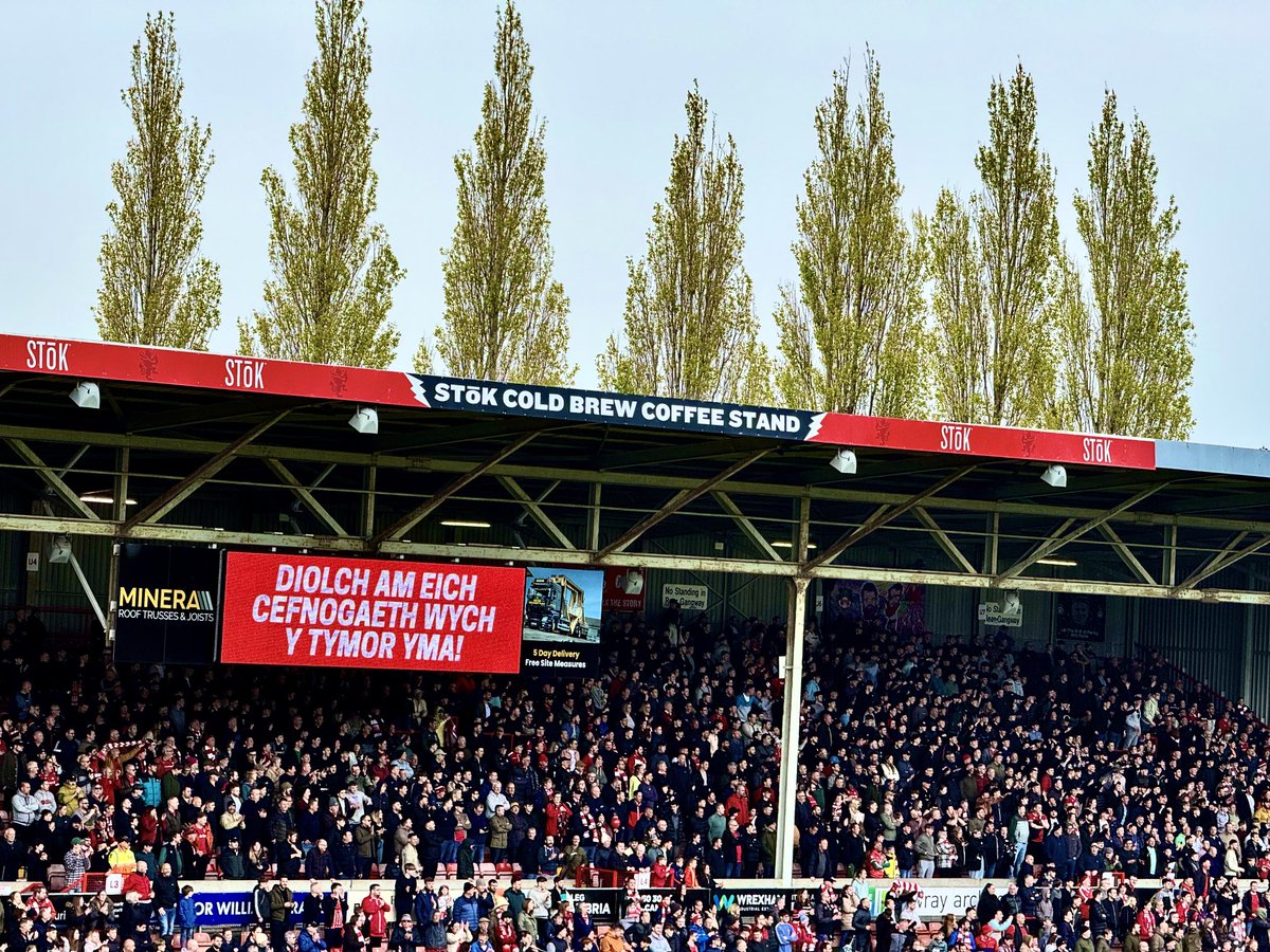 Those poplar trees, swaying in the breeze, a constant backdrop to whatever was playing out on the pitch, whatever was going on in your life beyond it: Win, lose or draw, the poplars will sway, & the football will distract for 90 beautiful minutes ⁦@Wrexham_AFC⁩ ⁦#WxmAFC