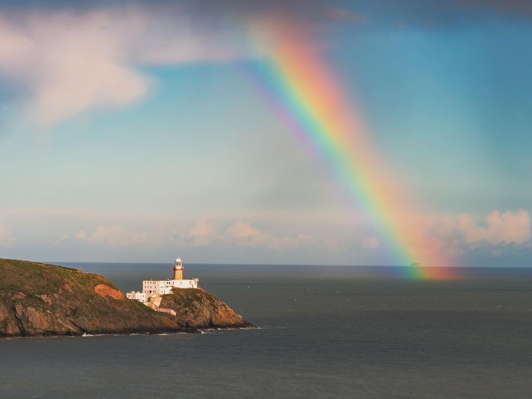 Anyone else believe rainbows make everything better? 🌈 This gem was captured beside Baily Lighthouse in Howth, Co. Dublin. Irish weather always puts on the best shows! 🌈 📸 @sryanbruenphoto
