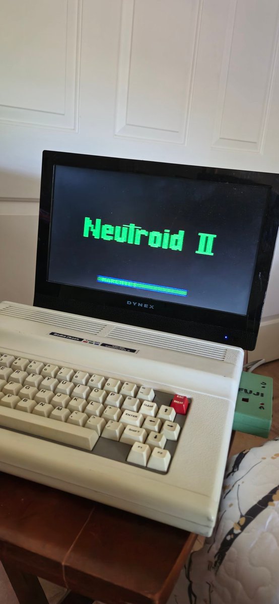 Rondelvo's tweet photo. From Down Under and brought to you by A Radio Shack CoCo 2 and FujiNet!!!...Sporting a CoCo3 Keyboard by Rick Ulland @ https://t.co/5CYGcn2S0e #thecoconation #coco2 https://t.co/5faxWet79M