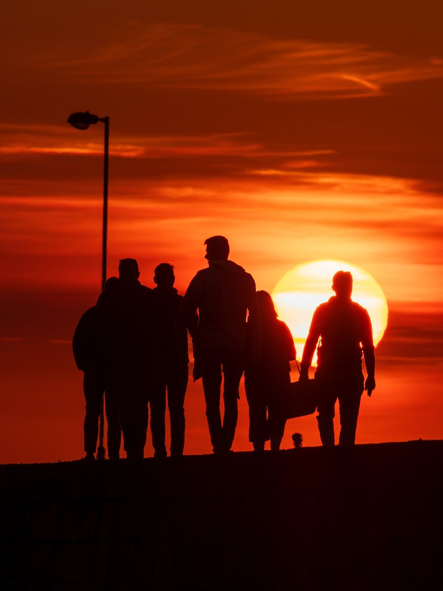 Sunset silhouettes on the Howth pier this evening.