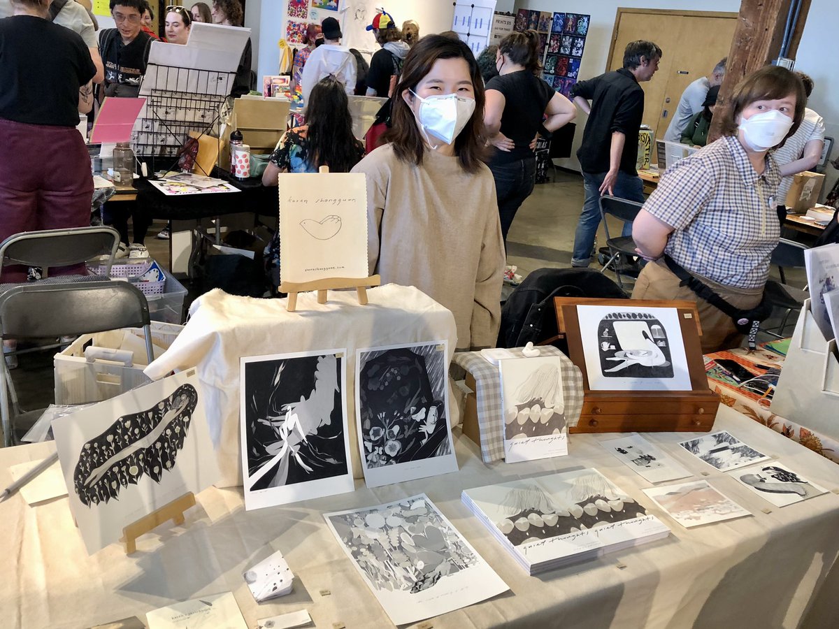 So much amazing &amp; diverse art in the Exhibition Hall! (left to right) Reggie Graham <a href="/Ziggyfin/">@reggiegraham.bsky.social</a> at table E2, David Wood at table B10, &amp; Karen Shanghuan @karenshgg at table B9! Check them out!