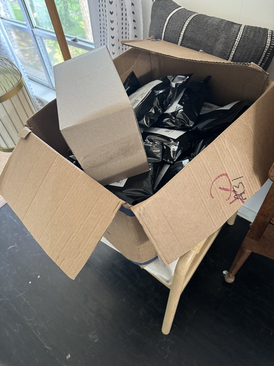 Last box of merch orders ready for pick up