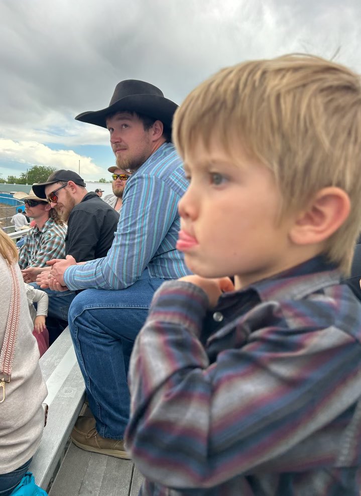 Intently watching the horse race at the Bucking Horse Sale