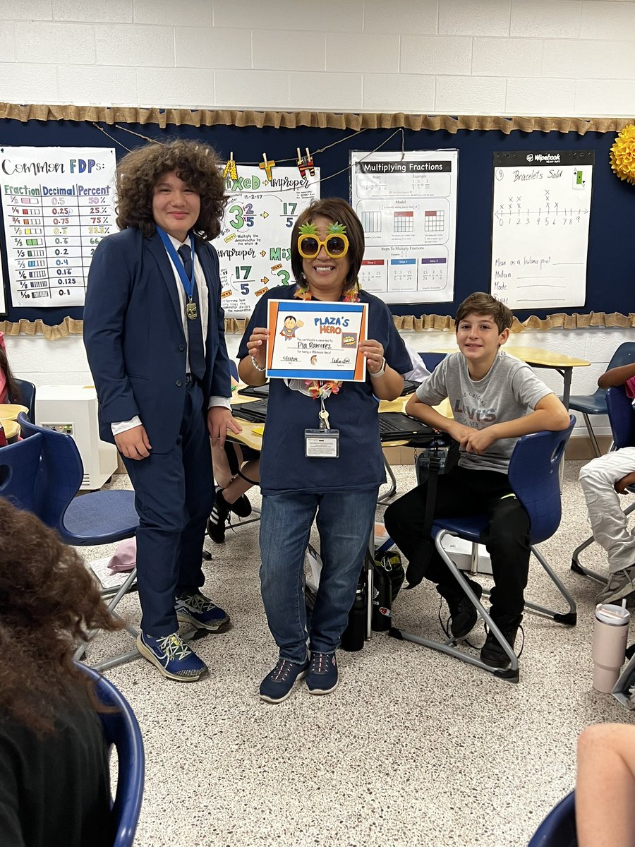 Today we celebrated @epiaramirez for being a hero at Plaza! 🦸‍♀️ Mrs. Ramirez was nominated by a student who said Mrs. Ramirez’s math class is the reason they like coming to school on B-days. 🧡😊💙