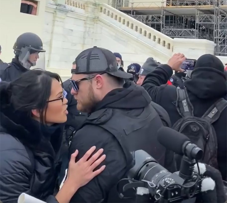 @DecodingFoxNews Savanah Hernandez was not just at the Capitol on Jan 6, she hung out with the Proud Boys on the front lines, climbed the Media Tower, and was one of the first to reach the Lower West Terrace. Here she's whispering with Ethan Nordean, now serving time for seditious conspiracy.