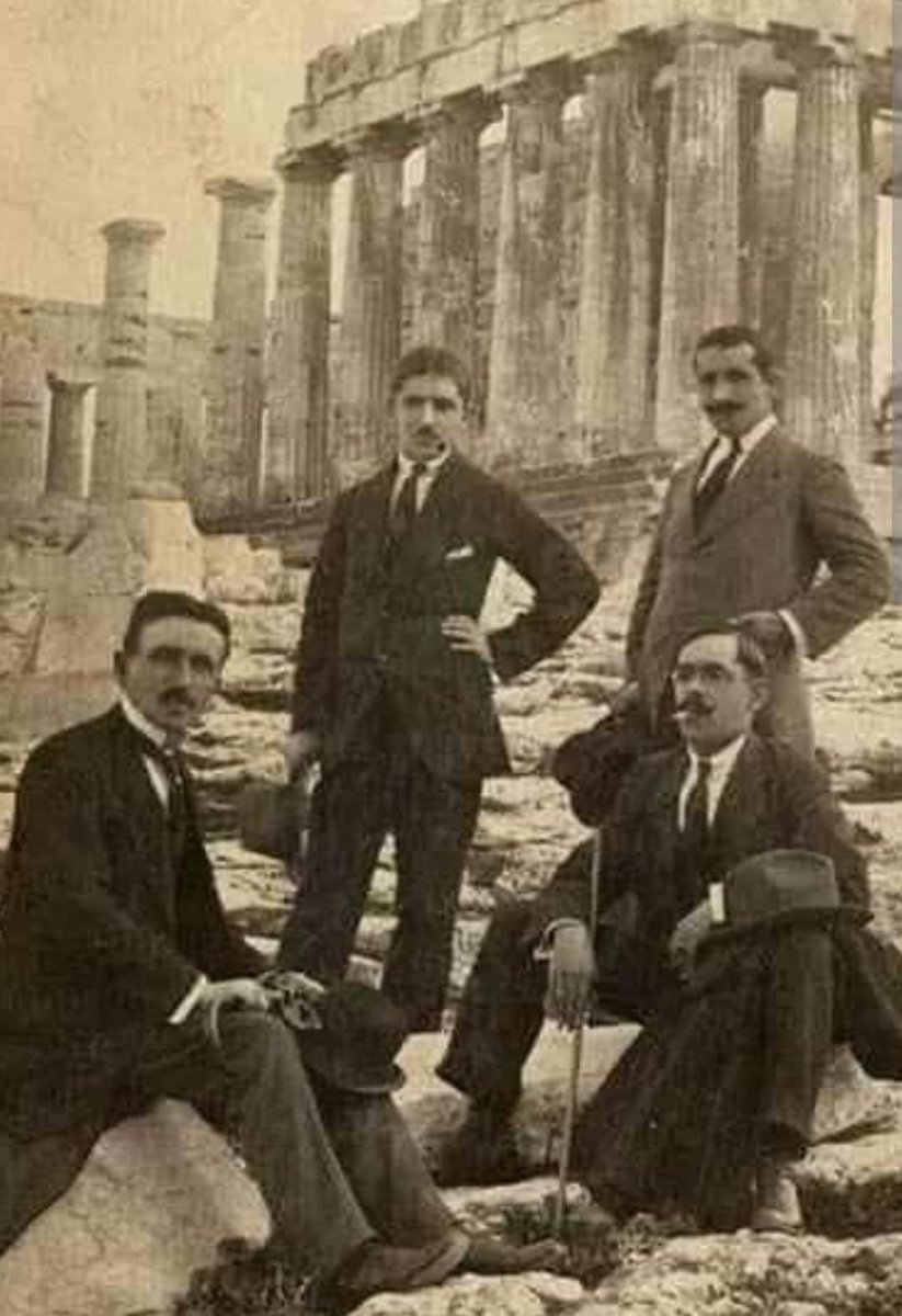 Nikola Tesla, Albert Einstein, and others posing together at the Acropolis in Athens, Greece.