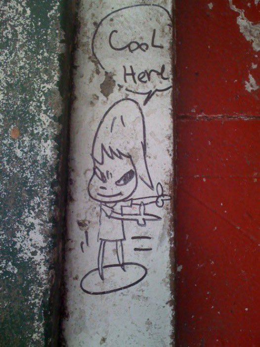 yoshitomo nara’s mugshot when he was arrested for a graffiti doodle that pointed towards his show