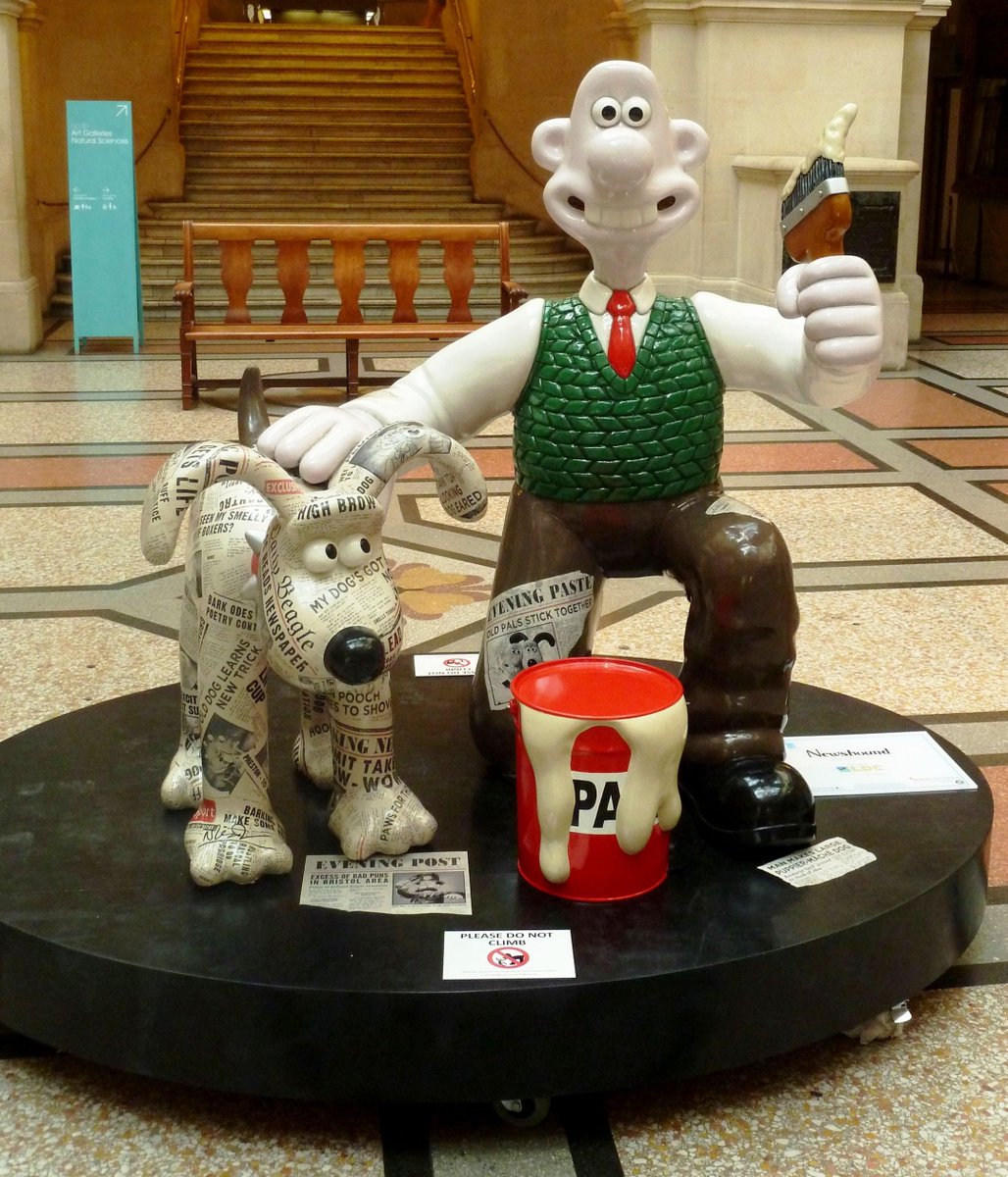 Hot off the press, lad – it's #InternationalMuseumDay. 🏛️ We're throwing it back to our ‘Newshound’ sculpture, exhibited in the Bristol Museum, during the first trail. The b-eagle-eyed of you might spot that Newshound is covered in headlines from the Wallace & Gromit films!