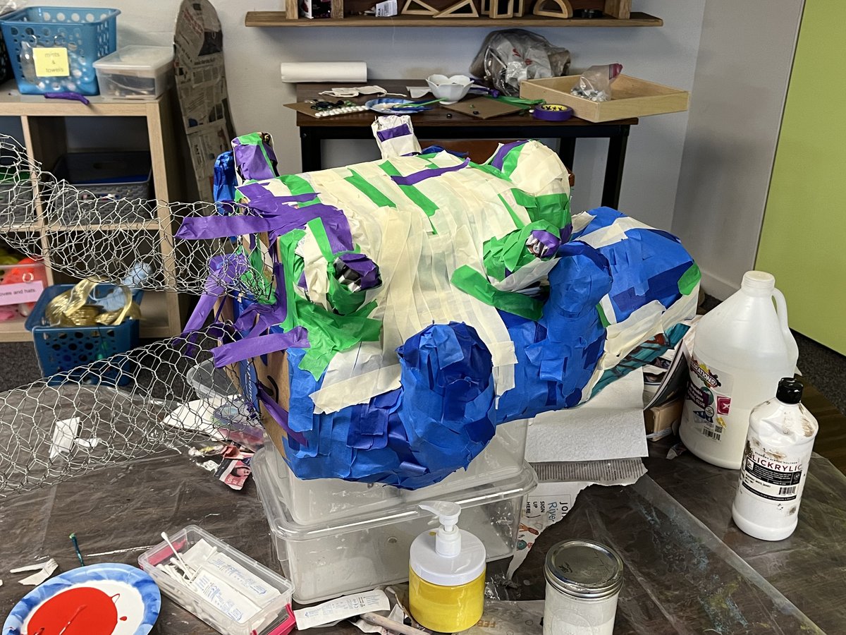 a paper maché otter 841 (and baby!) is being constructed by the after school...