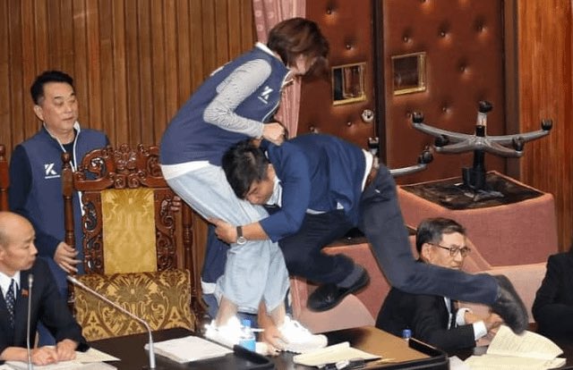 Taiwanese legislator tackles another to prevent a bill from passing.