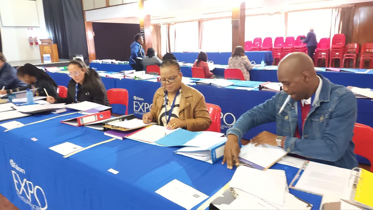 Selectors for the District Expo in the Welkom Region are pictured reviewing projects before the interviews begin. Tap the link 🔗 in our bio for upcoming District Expos across South Africa 🇿🇦 #DiscoverEskomExpo #DistrictExpos #WelkomRegion