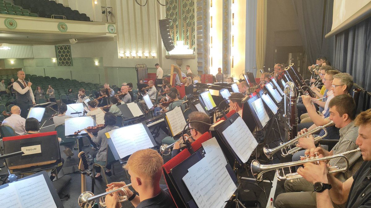 Capt Tom Griffin RM takes to the podium to rehearse #JurassicPark with our #brass and #woodwind teams giving it the full #JohnWilliams treatment.