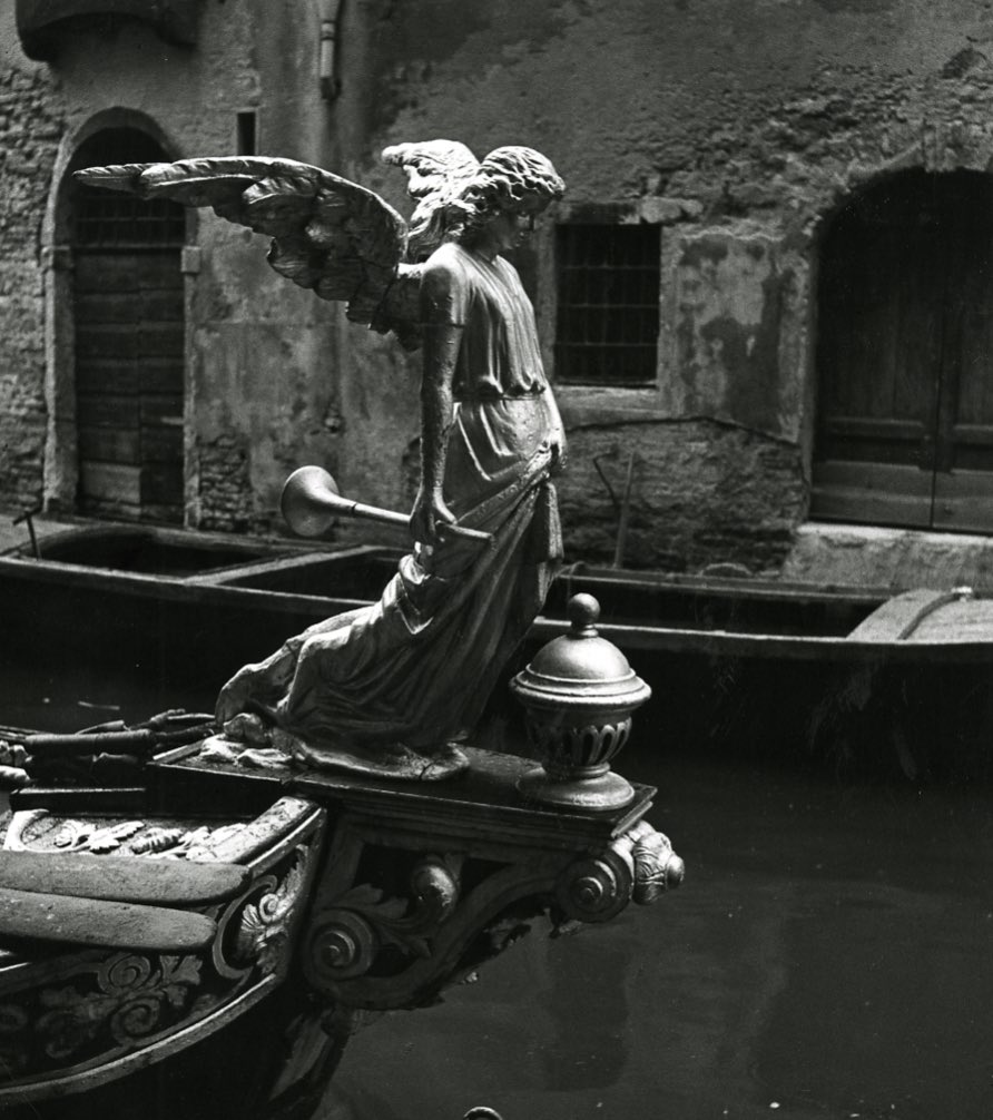 Venetian Angel of Death, at the front of a funerary boat, 1951.