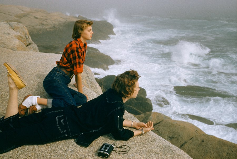 Two women gazing at the waves on the coast of Nova Scotia. Photography by Volkmar Wentzel, 1961.