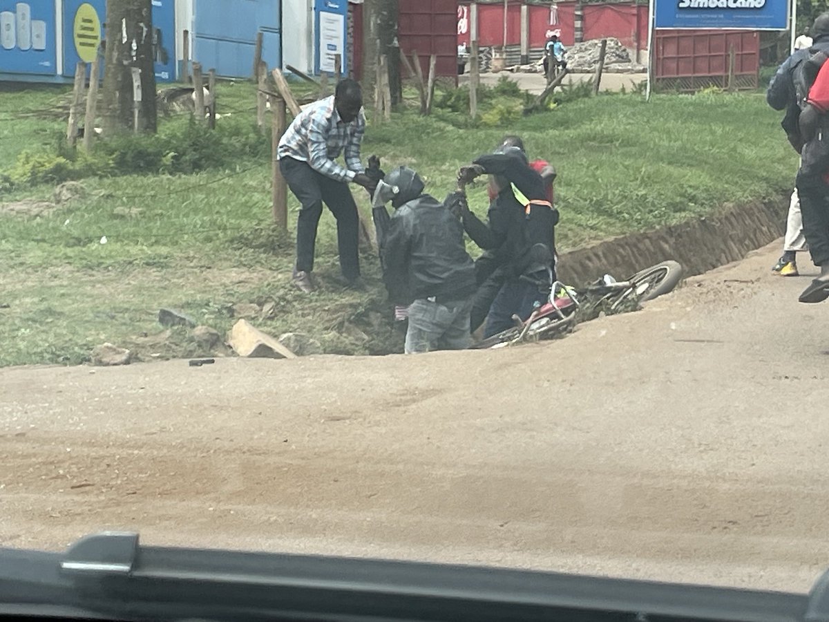Life is so cheap on Uganda’s hazardous roads. A motorist trying to dodge a motorcade with sirens (all civilian number plates) crashed into this boda rider and his passenger. Rider dead. Passenger leg broken. The “big people” simply drove on…
