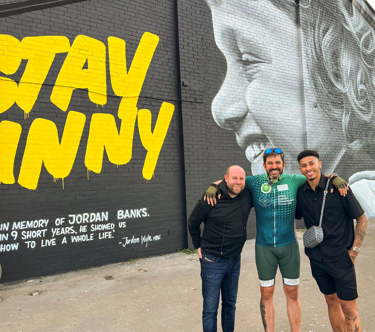 In memory of Jordan Banks. 🧡 Jordan Gabriel and John Hills meeting @jordanwylie3211 after completing his epic 3000km Tower Power challenge. 🍊 #UTMP | @MurWalls