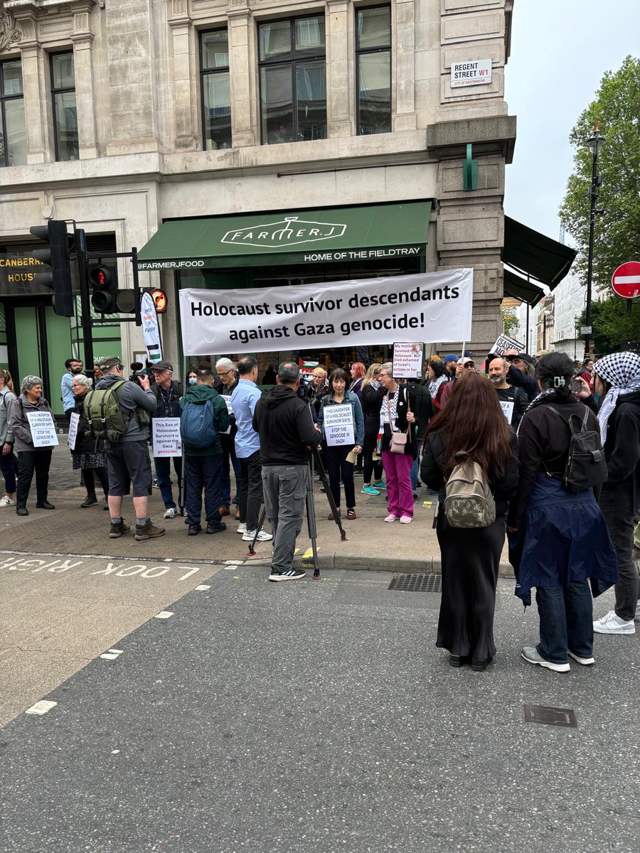 These two signs shouldn't be able to coexist but the crowd is tolerant of hatred so long as it isn't opposition.