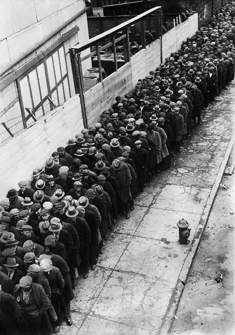 Men waiting in a line for the possibility of a job during the Great Depression.