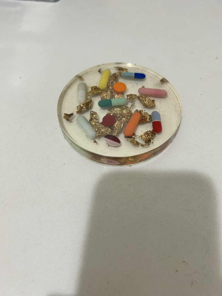 few bigoted things will ever be as funny as this coaster my terf mom made at church arts and crafts full of pill casings for me, her “favorite little lifetime big pharma addict”