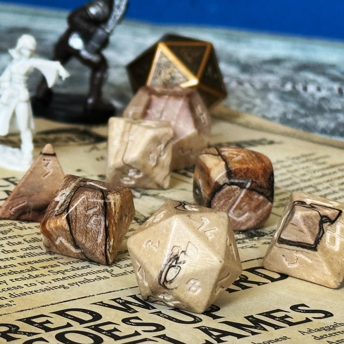 Avid gamers need variety not only in the fantasy world but also with the materials they use. Let us showcase this beautiful Splatted Tourmaline Wooden Dice set! A captivating lightness tone with swirls of earthy browns.