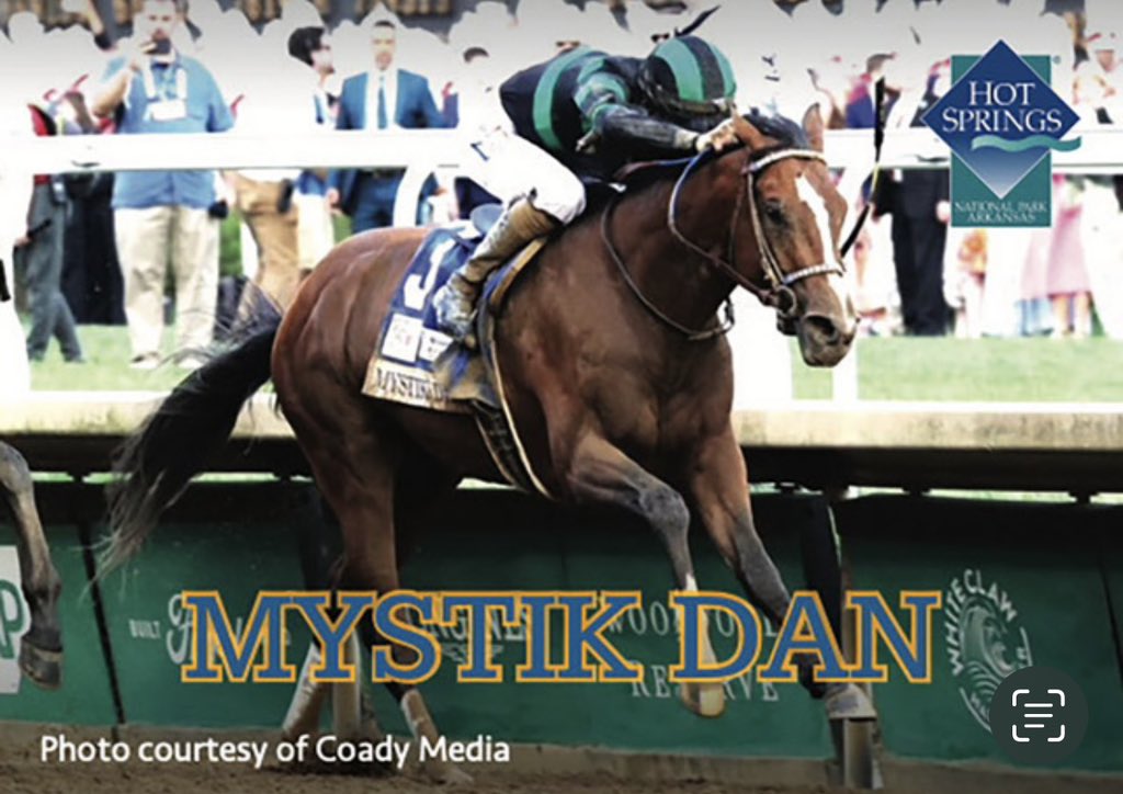 If you are near Hot Springs, Arkansas today, it might be worth a stop at either the Hot Springs Convention Center or Oaklawn Racing Casino Resort to grab the first trading card of Mystik Dan. Visit Hot Springs printed 30,000 of the cards to be given away, while supplies last.