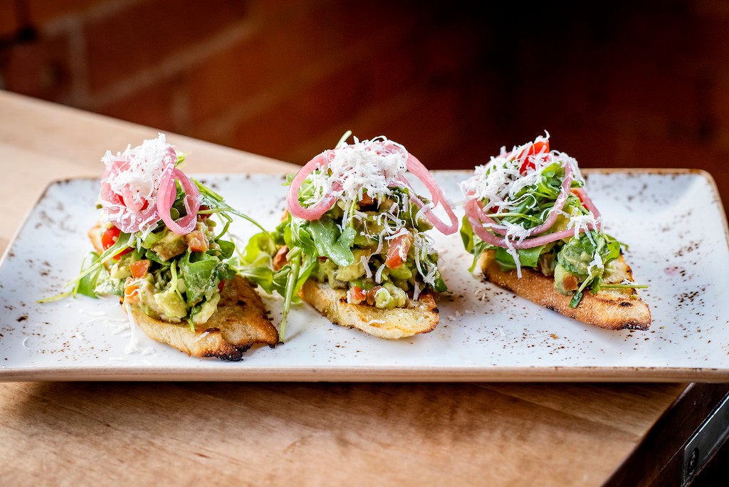The ultimate Avocado Toast. 🍽️: Avocado Toast garlic toast, avocado, cherry tomato, arugula, sliced chilli, pickled onions, ricotta salata Join us at Cibo Wine Bar for brunch every Saturday and Sunday from 11 am to 3 pm. Reserve your spot at cibowinebar.com ✨️