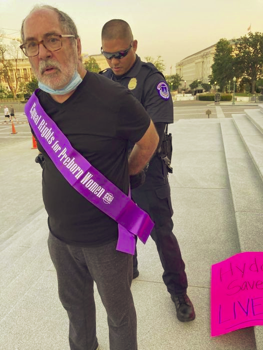 Historic Victory! Here is a picture of me being arrested on the steps of the U.S. Capitol in 2021 at a peaceful demonstration. Yesterday, a Washington, D.C. federal judge ruled on our lawsuit saying, the STEPS OF THE US CAPITOL ARE OPEN! You are NOW FREE to pray and