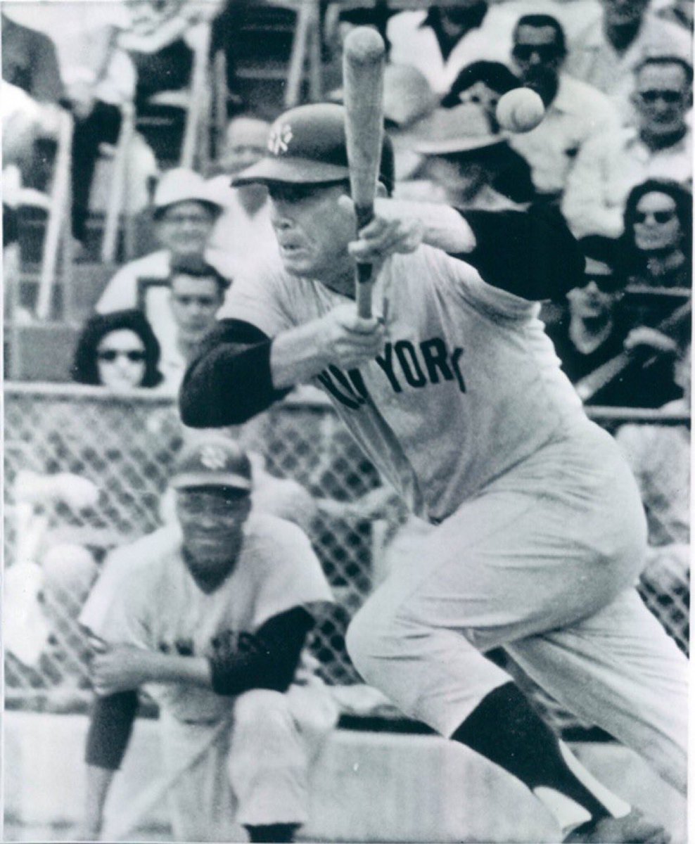 Mickey Mantle attempting to bunt. You can tell by this picture that he got out of the box real quick early in his career. The man had speed