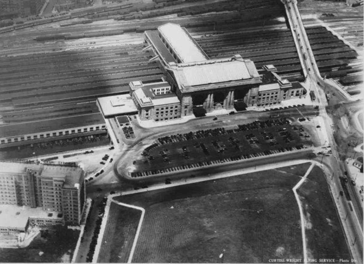 From 1930, an aerial photo captured by Curtiss Wright Flying Service showing Union Station and train sheds, along with the Railway Express Agency facility immediately to the west of the Station.