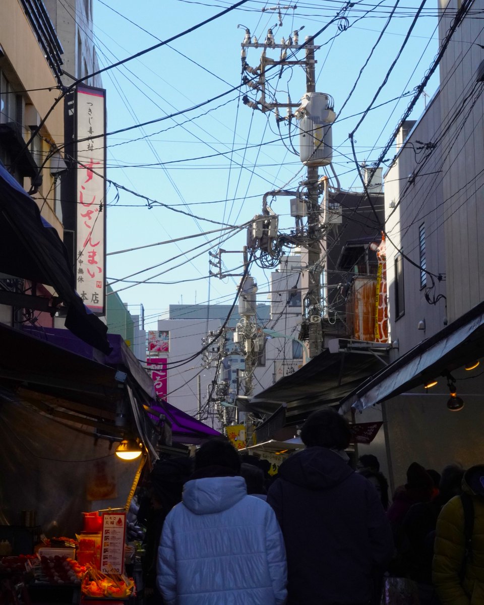 Tsukiji Outer Market is Japan’s Food Town. It's everything I love about cities: historic, grungy, narrow, colorful, tasty. Black squid dumplings, buttery miso cod, crab, calamari and more! #streetphotography #TsukijiOuterMarket #tokyo #japan #fish #seafood #publicmarket #travel