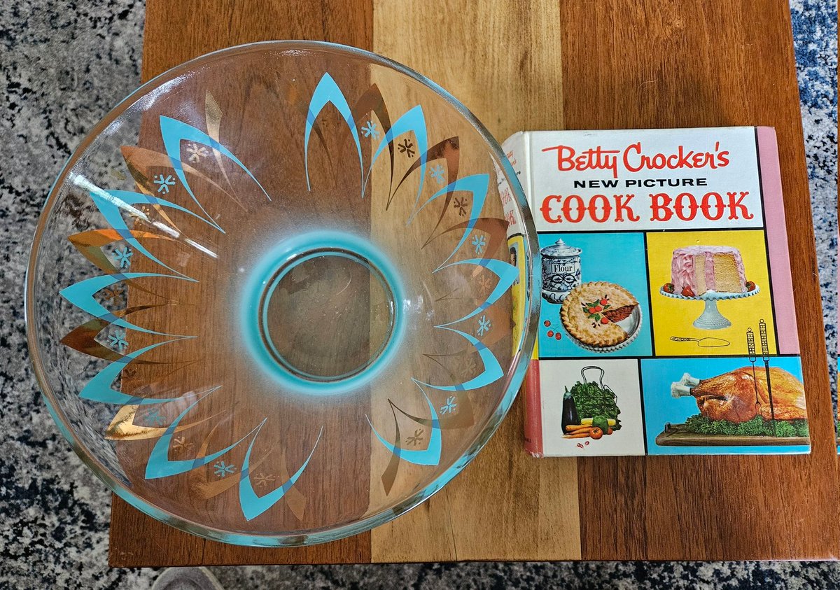 My purchases today! I'm definitely using this bowl for popcorn. Also, I've been looking for this cookbook for awhile and it's usually decently pricy online. Thankfully, it was under $20 and it's in fantastic shape! Also, I did get one small mold. 😉