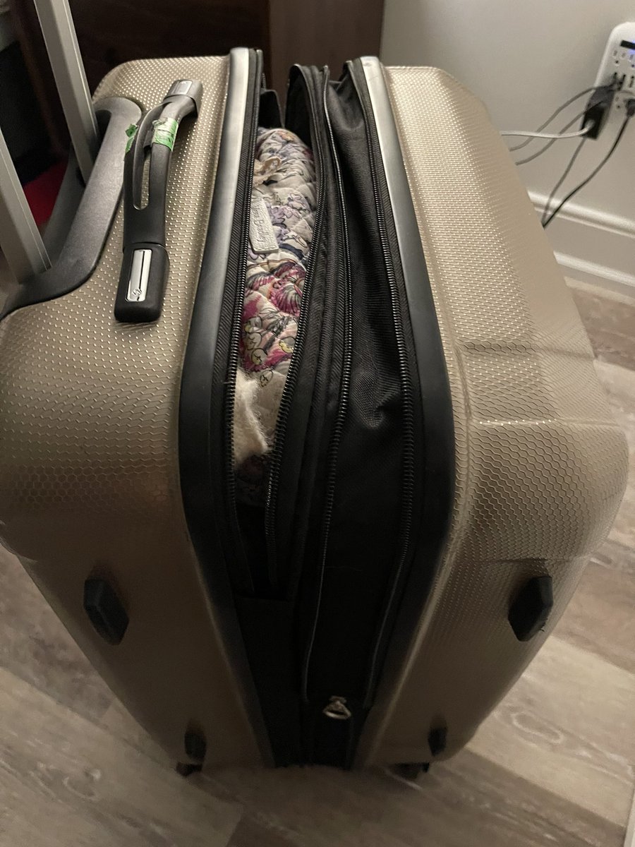 catbardon's tweet photo. @AlaskaAir tried to get to the baggage claim area to report this but SeaTac is under construction. Would love support given my suitcase was left in the corner of the airport, opened, and damaged. https://t.co/g0rkxKsrXi