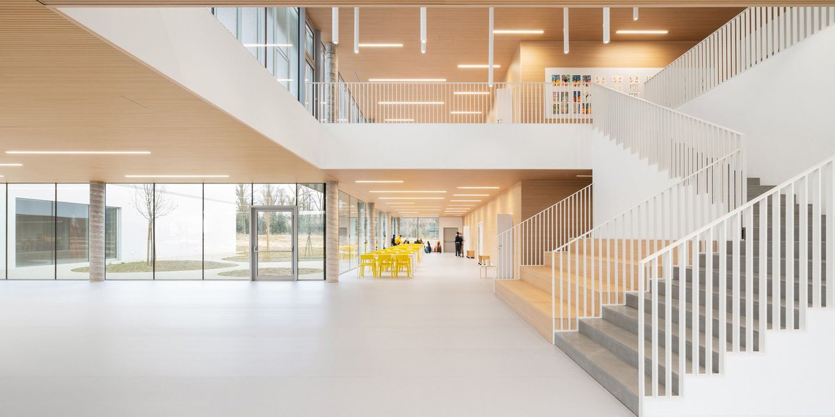 artico fracassi wraps italian school in glass and perforated encasing to bring the outdoors in buff.ly/4biZCoK