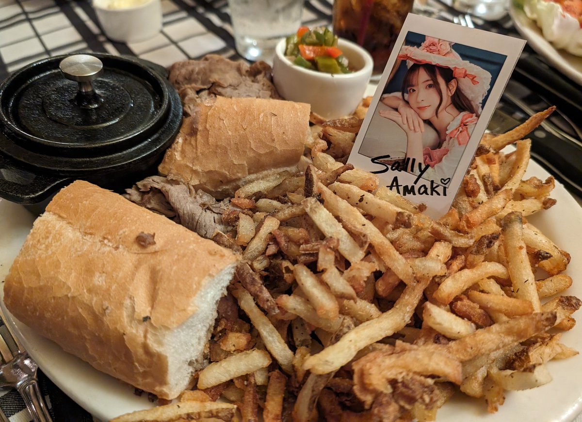 Sally lying on a pile of fries