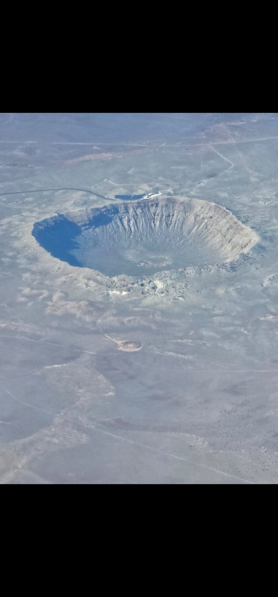 I took this of Meteor Crater ( near Winslow, AZ ) couple of weeks ago from a plane. Largest preserved crater on Earth.  Object 80 ft across at 40k mph left crater 1/2 mile 50k years ago. Dinosaur killer asteroid was 6+miles across, left Philadelphia to New York sized crater!!!!